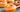 Donut Cake Pops mit Zuckerguss und Goldpulver